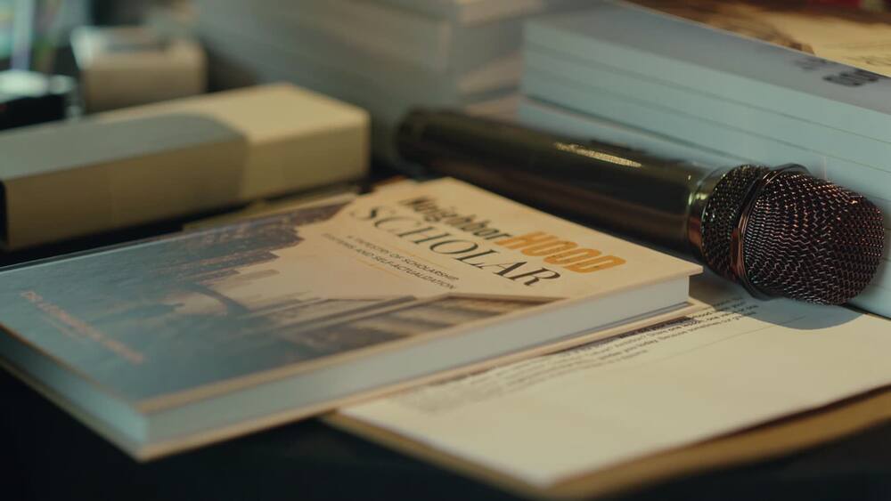 The book beside a microphone at the event
